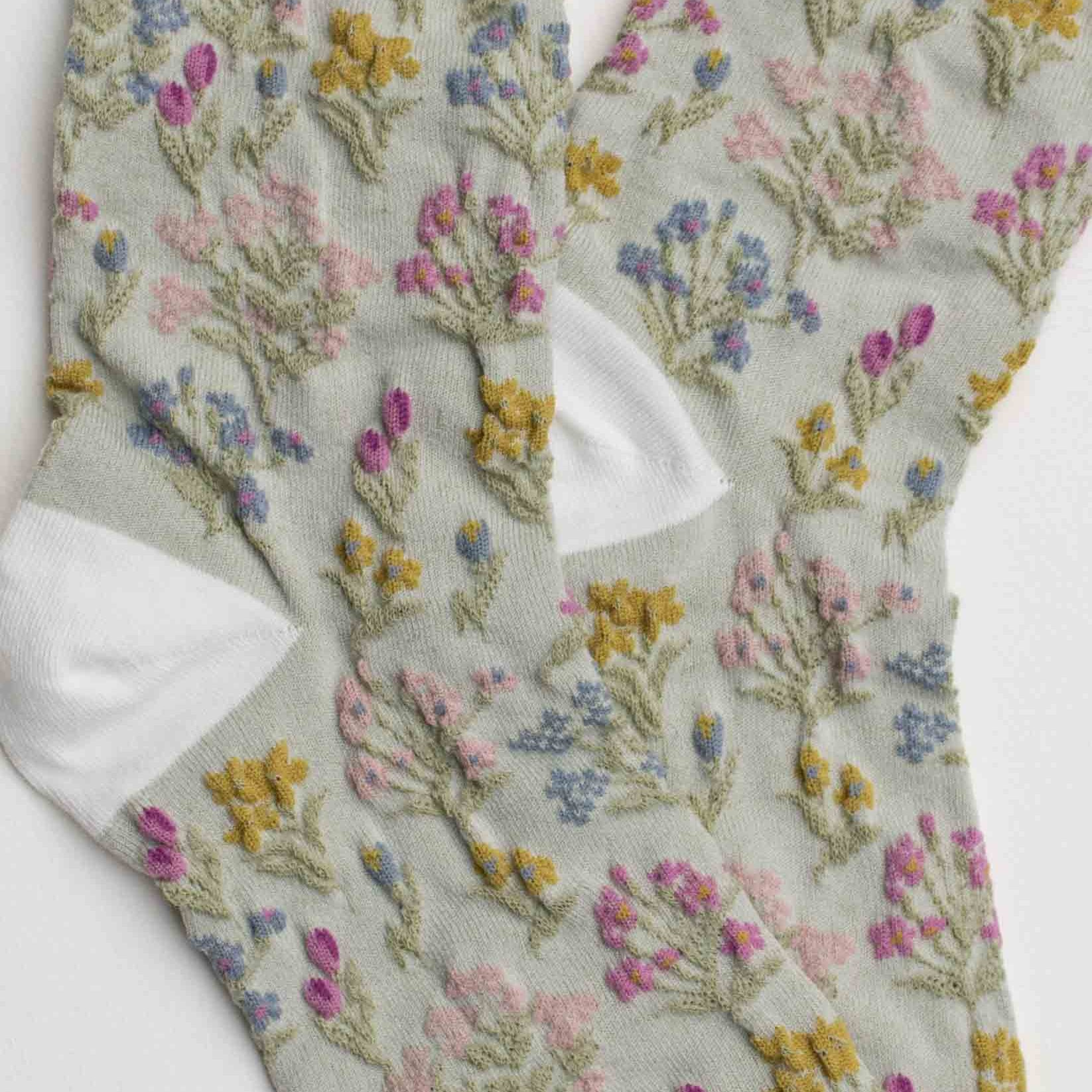 Floral-patterned sock on a light gray background