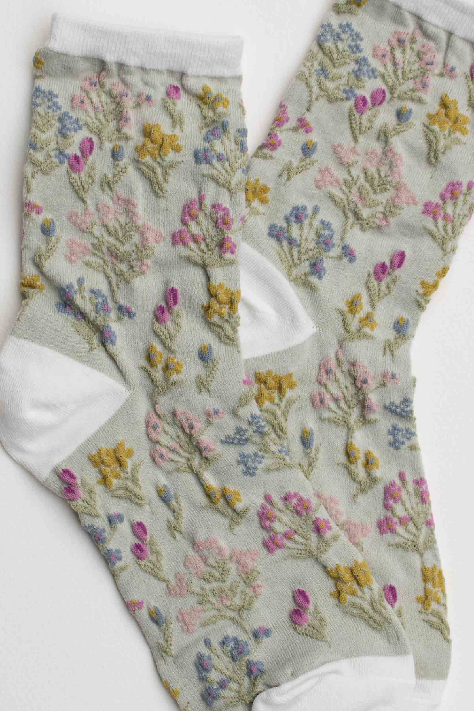Floral-patterned sock on a light gray background