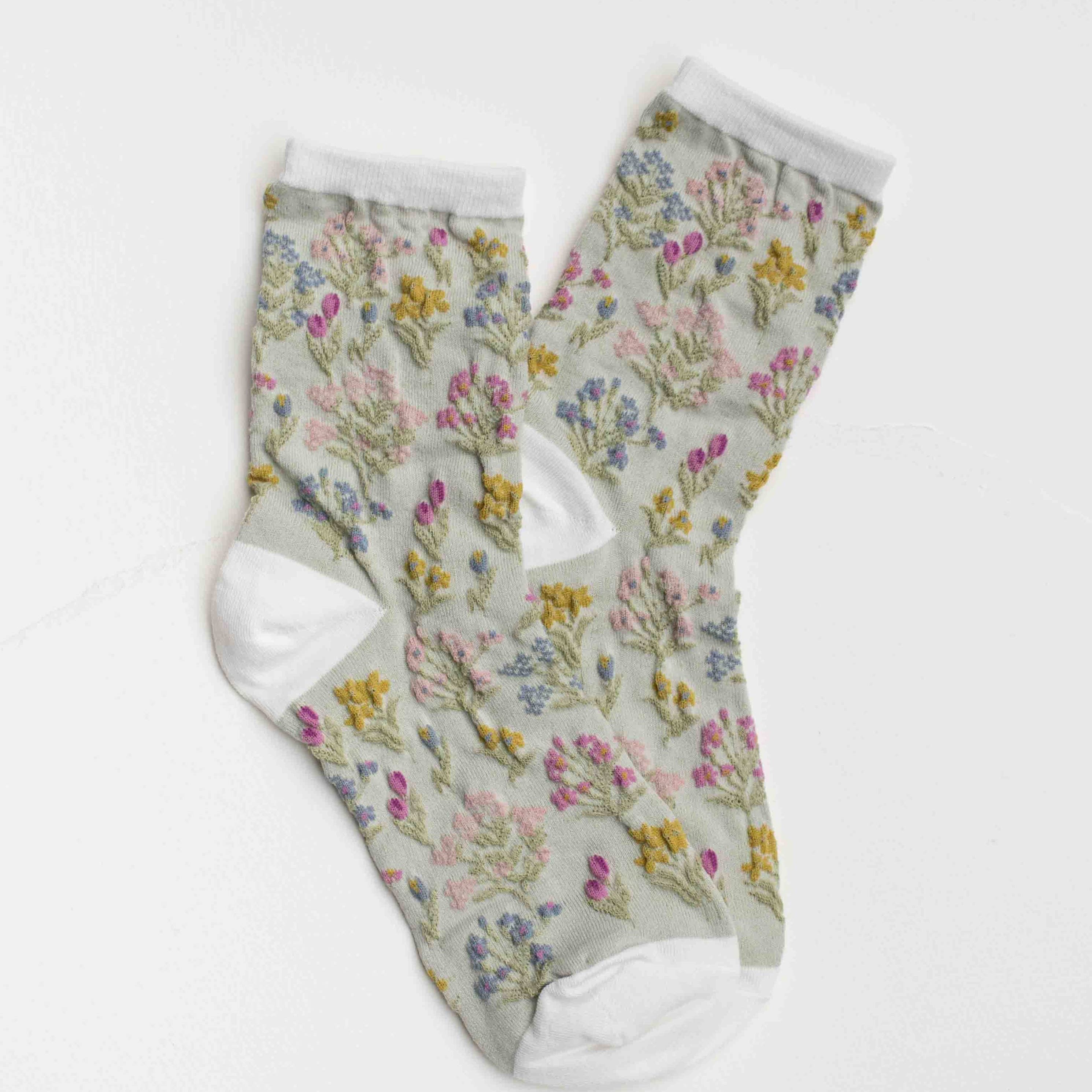 Floral-patterned socks on a white background