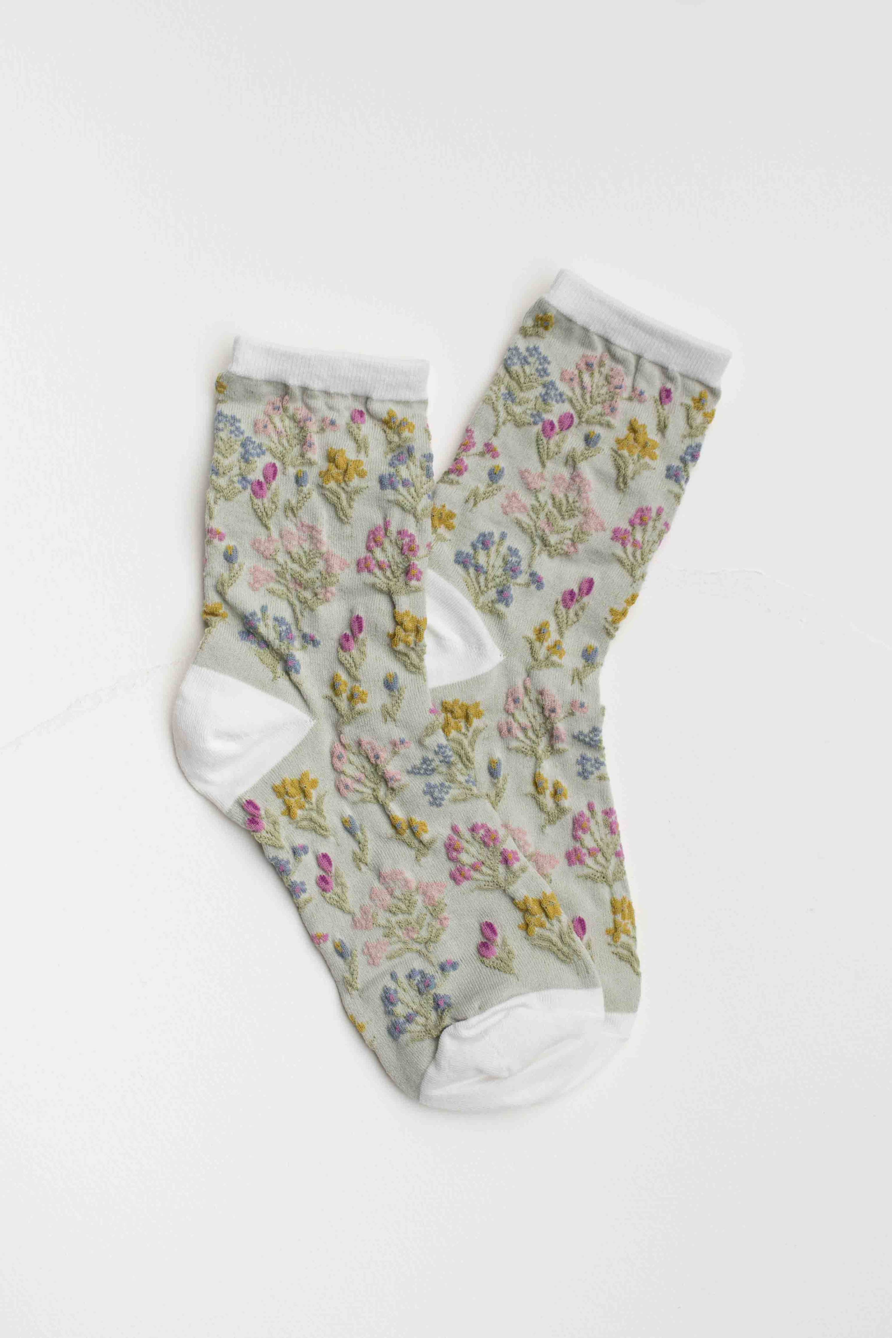 Floral-patterned socks on a white background